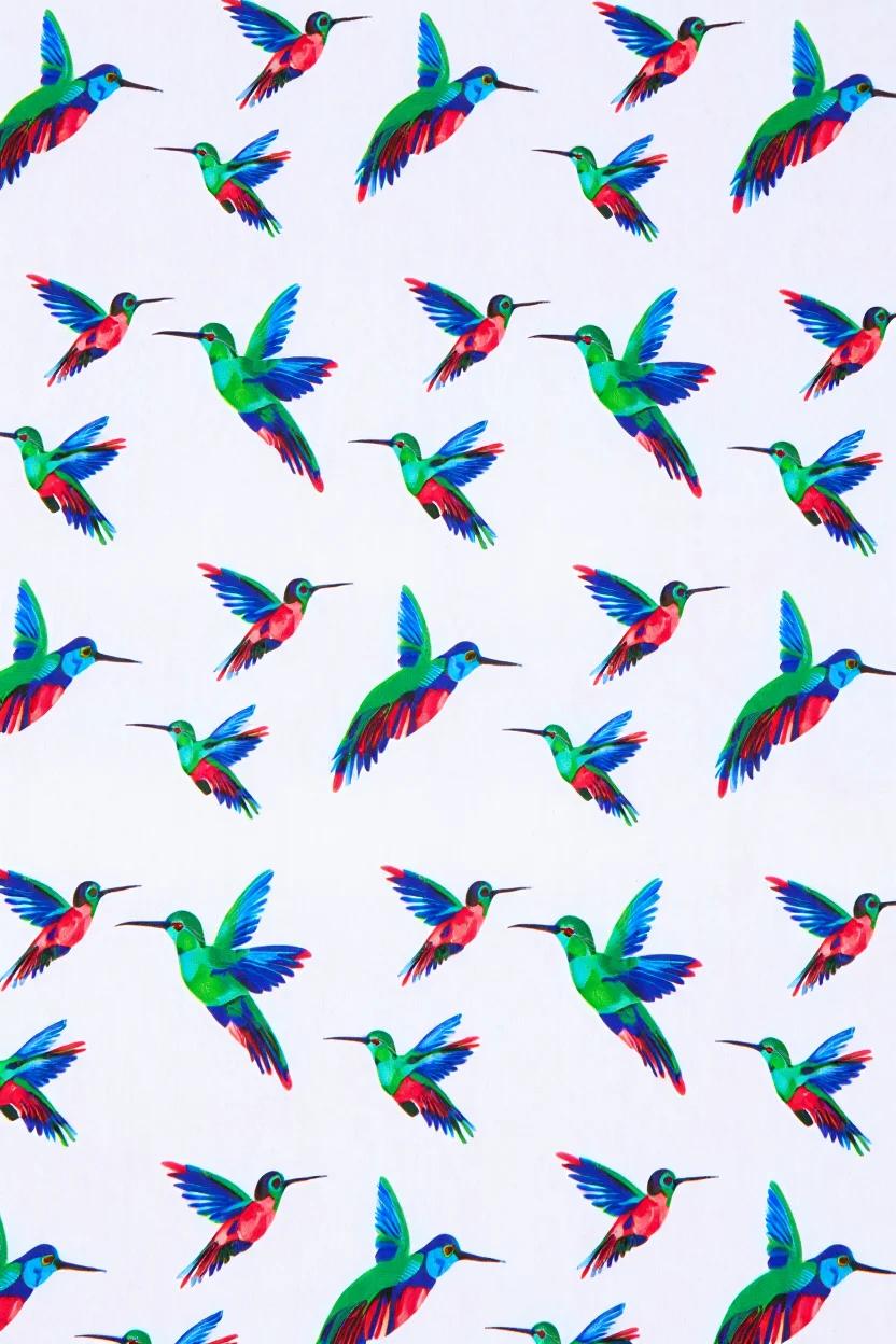 A square bandana textile features a repeating pattern of colorful hummingbirds in flight against a white background. Each hummingbird is rendered in vibrant jewel tones of emerald green, sapphire blue, and ruby red, with distinctive long beaks and hovering wings spread wide. The hummingbirds are arranged in a symmetrical grid pattern across the fabric, with each bird positioned at regular intervals, creating a cohesive decorative design that extends to all four corners of the bandana.  Close-up product photography with flat lay composition and even lighting to showcase fabric pattern details.